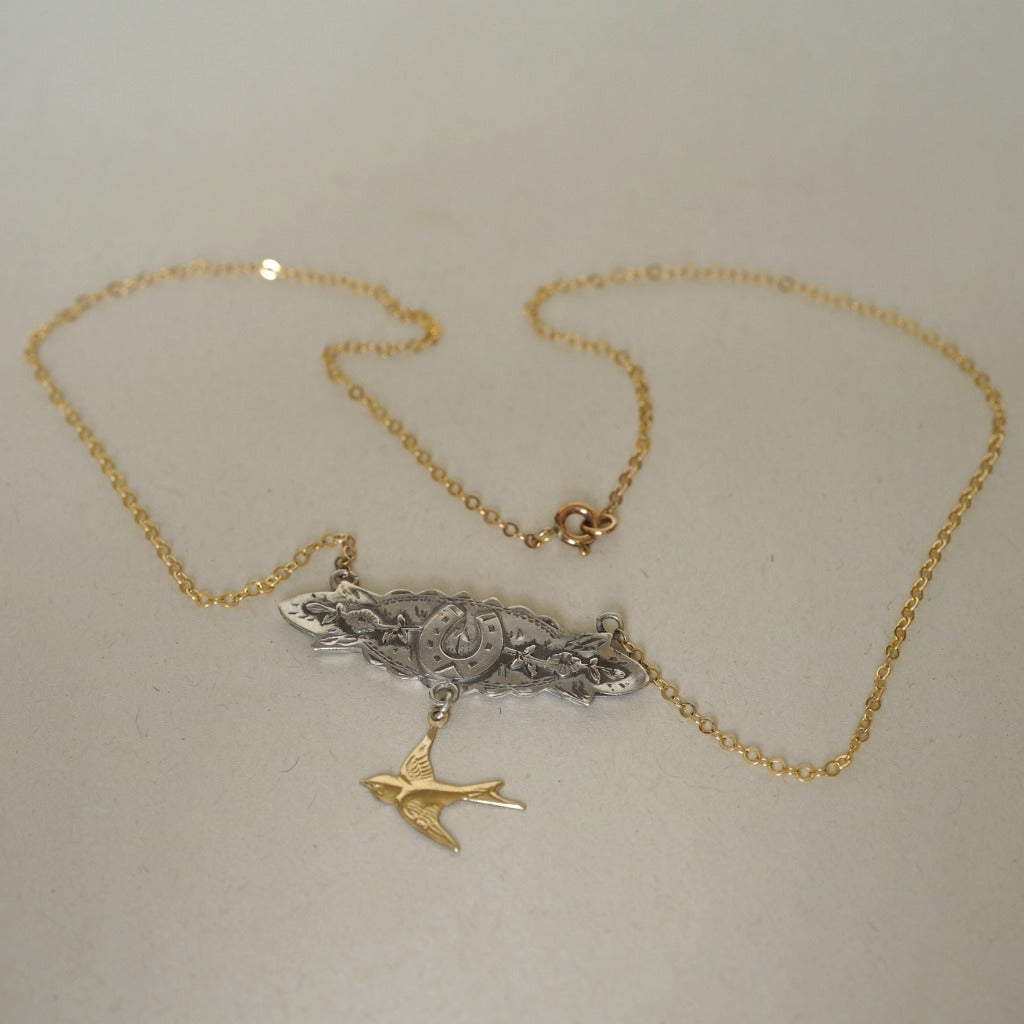 Silver and Gold Horseshoe and swallow necklace Badger's Velvet