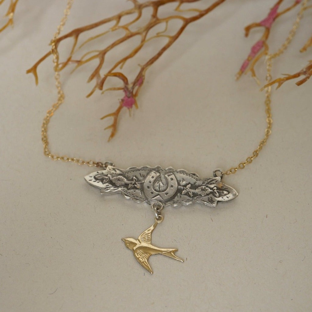 Silver and Gold Horseshoe and swallow necklace Badger's Velvet