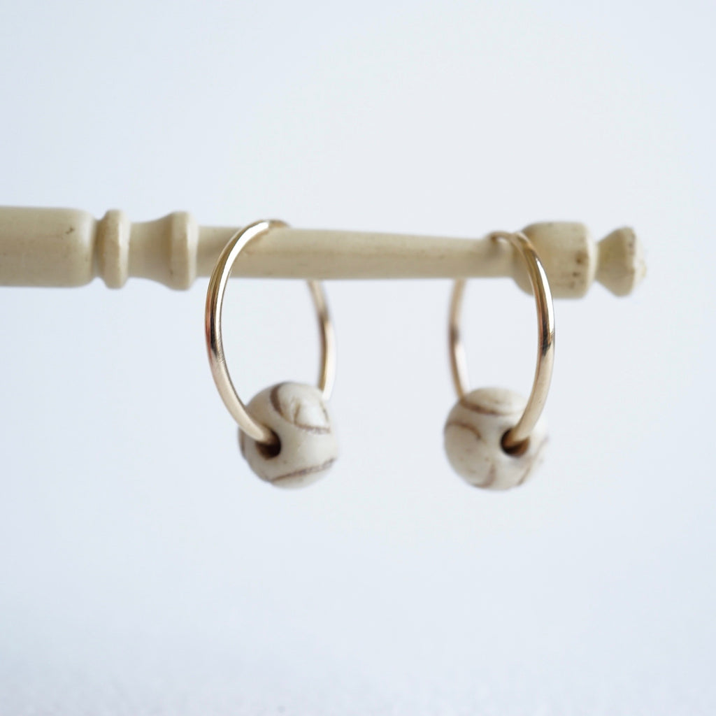 Gold Hoop Earrings With Carved African Bone Beads