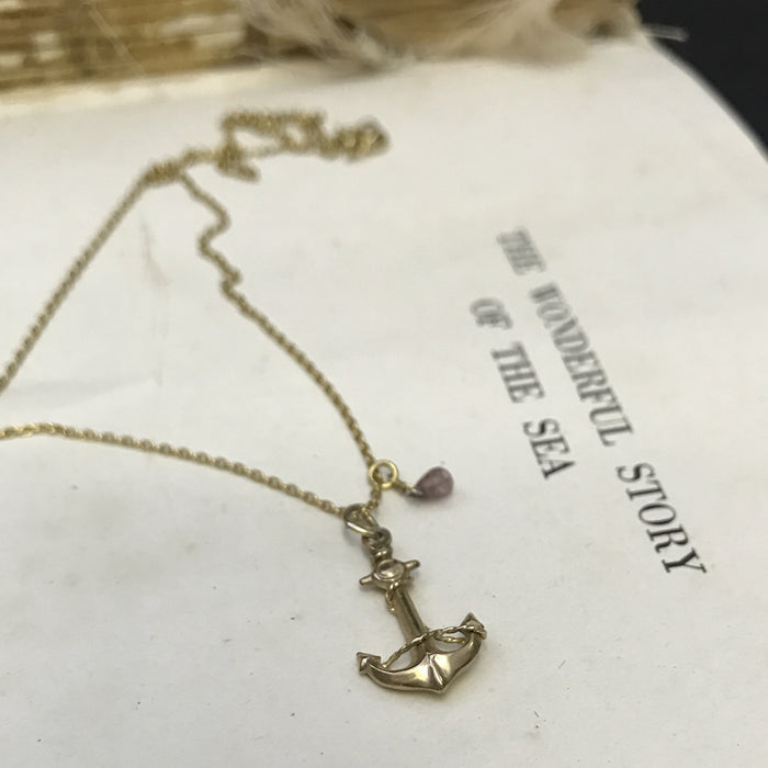 Gold Anchor charm necklace.