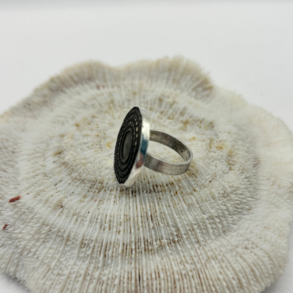 A unique ANCIENT Bronze button set in silver to create a ring