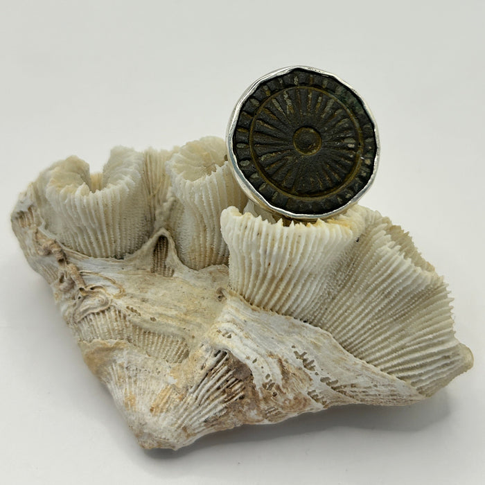 Unique bronze coin/button set in silver and transformed into a unique ring