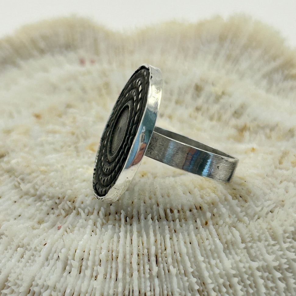 bronze button and silver ring 