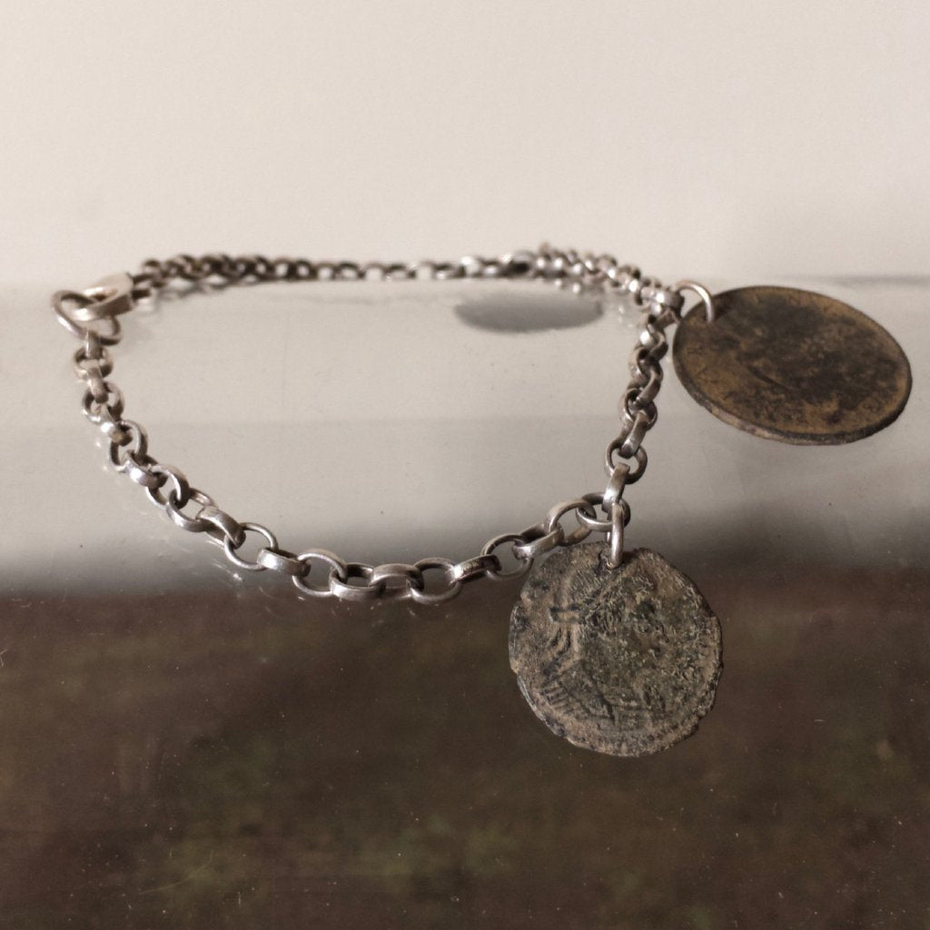 Silver charm bracelet with Roman Coins 